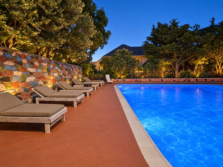 Pool and loungers in the evening light