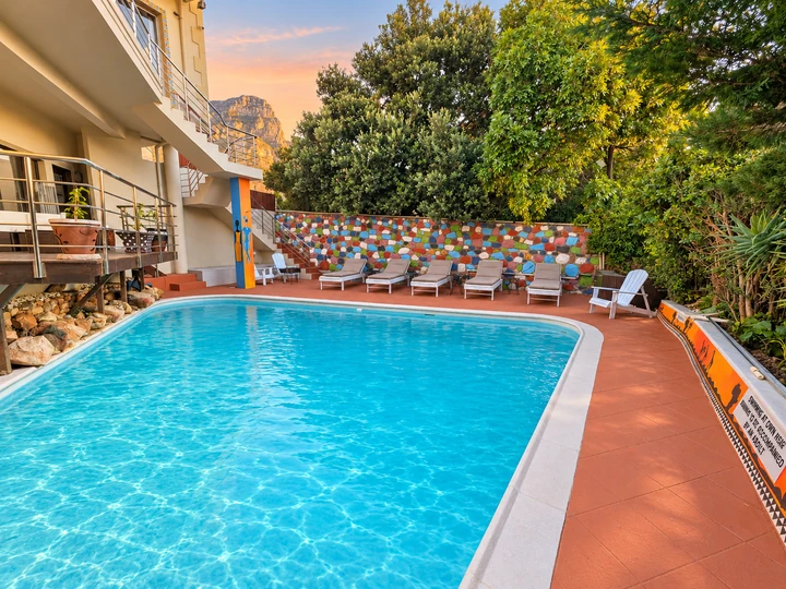 Pool terrace and colourful African stone wall