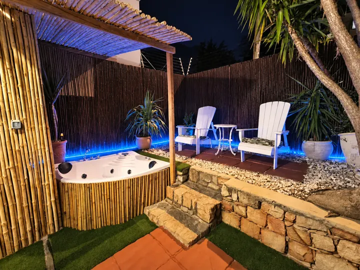 The private jacuzzi patio at night